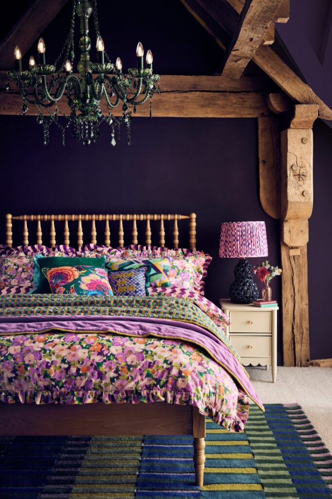 Colorful floral purple bedroom with rustic cottage charm